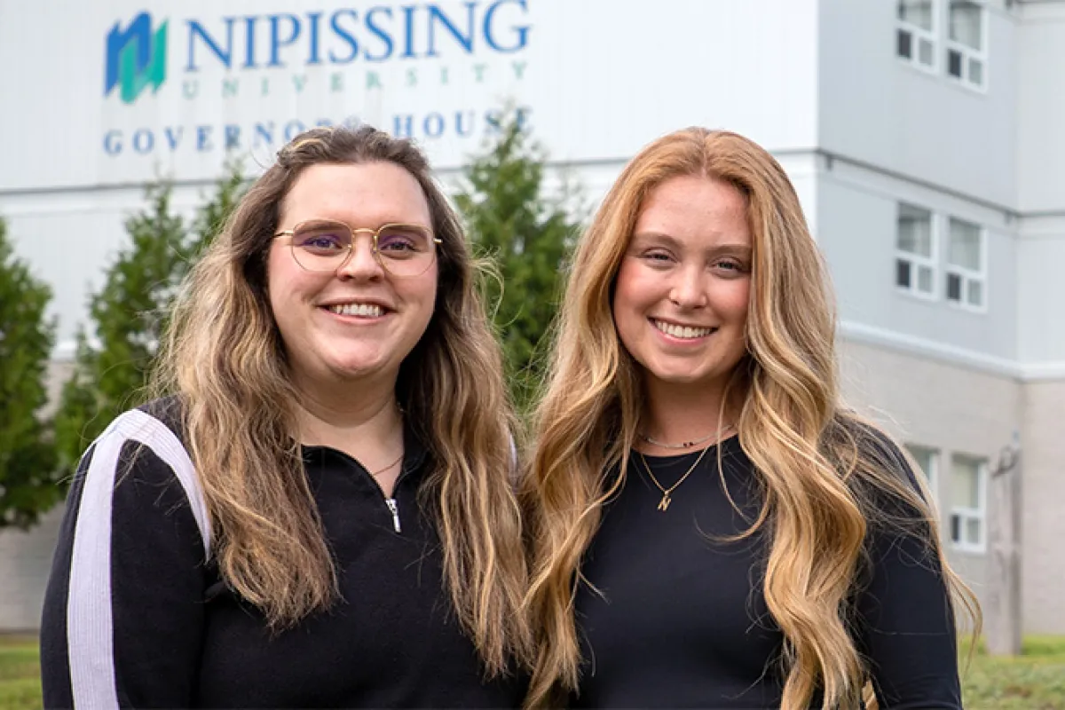 two smiling students