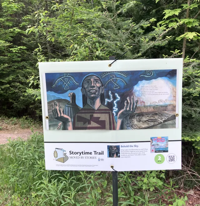 StoryWalk sign on the campus trail