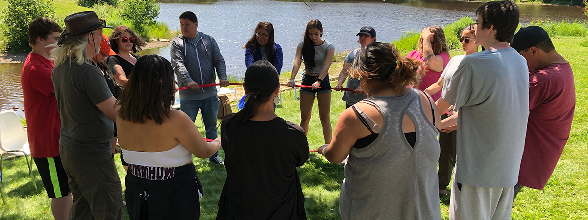Summer Indigenous Institute group by pond