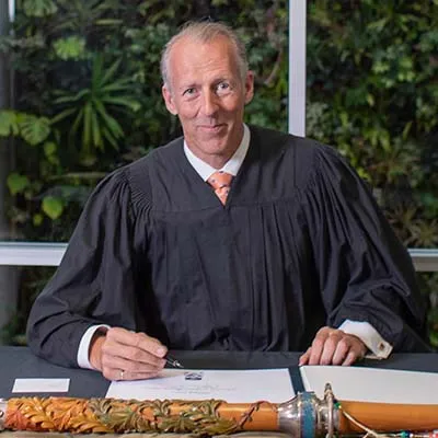Patrick Dion signing Honorary Doctorate register