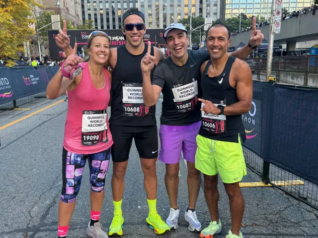 Margarida and Paulo with brothers after crossing the finish line