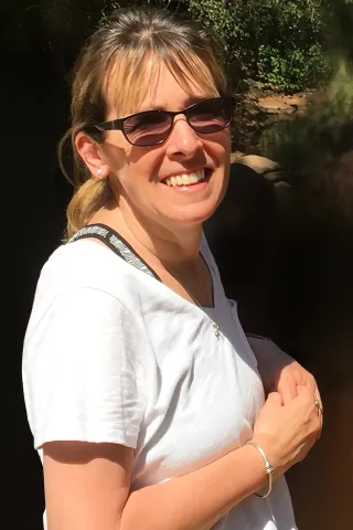 Laura Frank in front of a nature background