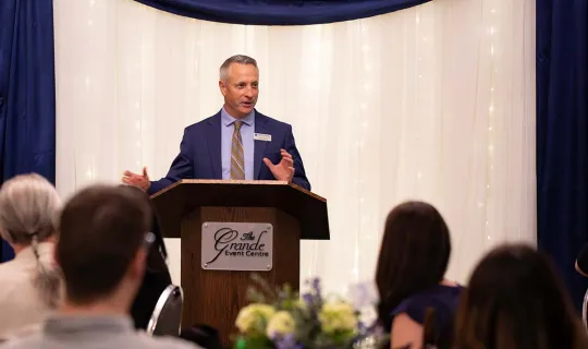 Nipissing University President Kevin Wamsley addresses crowd