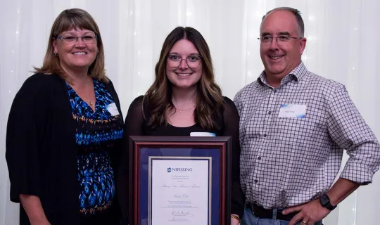 Megan Odd Rising Star Alumni Award winner with family