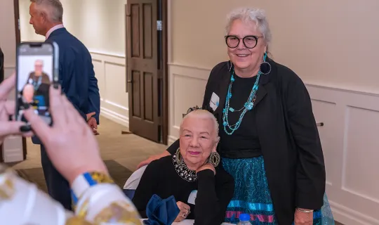 Dr. Joyce Helmer, Dr. James Jamieson Influential Alumni Award winner with guest