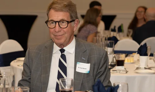 Chancellor Scott Russell enjoys dinner