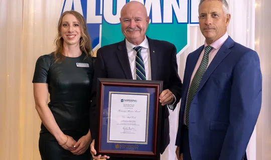 Dr. Paul Cook receives the Honorary Alumni Award