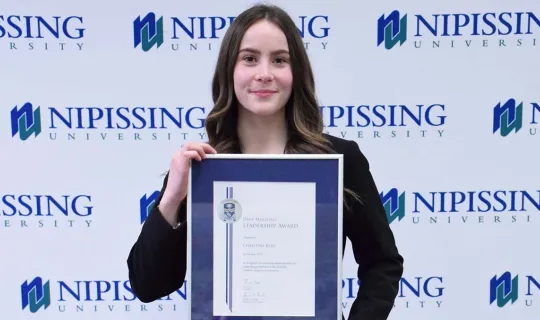 Christina Reid with award
