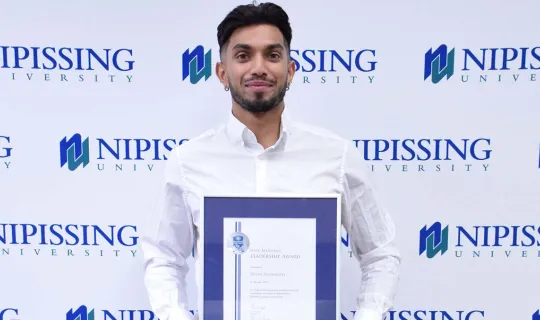 Deven Doodnath with award