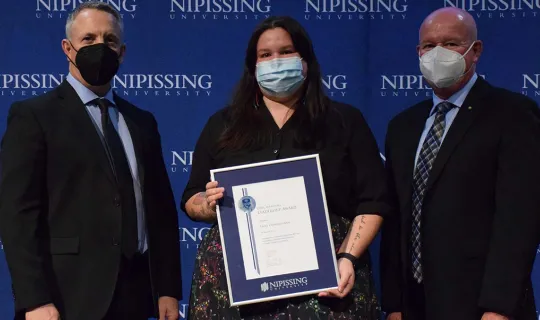 Emily Otowadjiwan with President and Chancellor