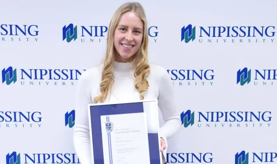 Kristen Jackson with award