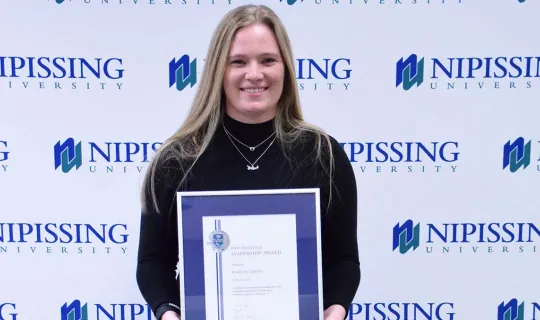 Marilyn Fortin with award