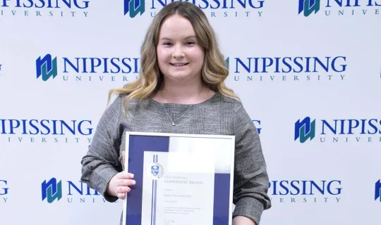 Mercedes Parsons with award