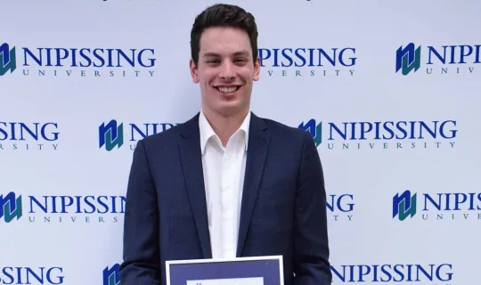 Randy Beauchamp with award