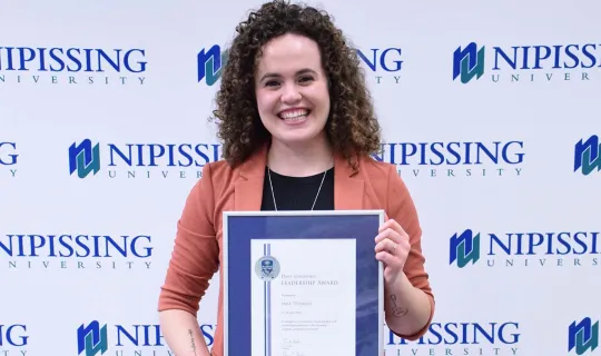Sara Tetrault with award