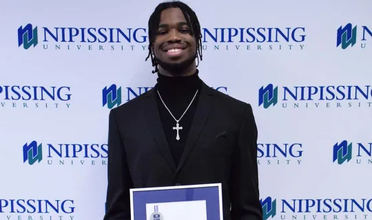 Taijon Eccleston-Graham with award