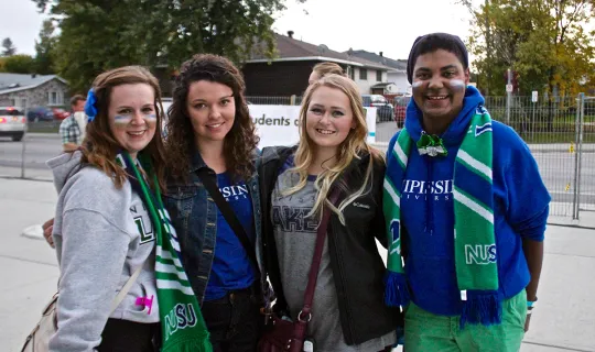 Students outside Memorial Gardens at Homecoming