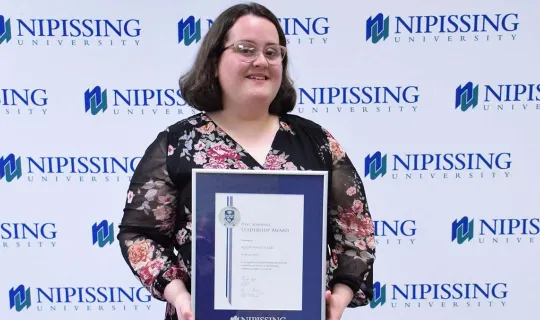 Allyn Whitehead with DMLA award