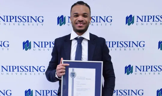 Tyrell Chambers with DMLA award