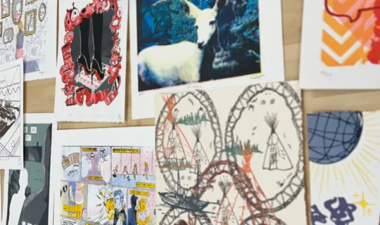 Feature images including artwork by Nipissing students