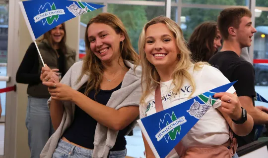 Students and alumni celebrating Homecoming