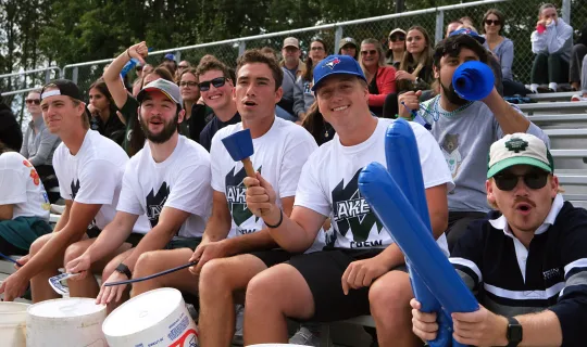 Student and alumni fans cheering on the Lakers during Homecoming weekend