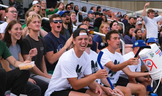 Student and alumni fans cheering on the Lakers during Homecoming weekend