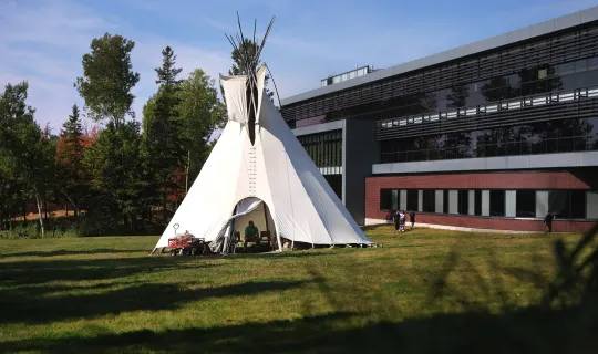 Kicking off Homecoming weekend with a bonfire in the Library Teepee