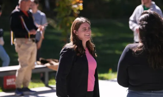 Laker smiling outdoors during NU Homecoming 2025