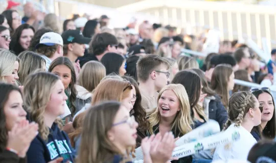 Crowd socializing during NU Homecoming 2025 games