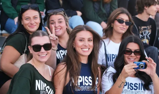 Lakers posing for a photo during NU Homecoming 2025 