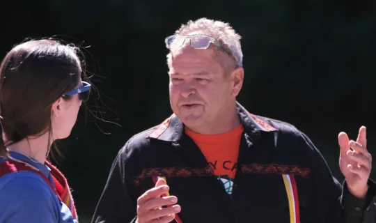 Norm Dokis speaking during guided nature walk