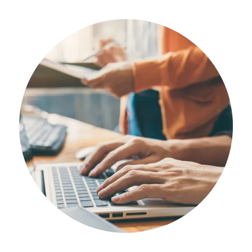 Individual working on a laptop pursuing professional development.