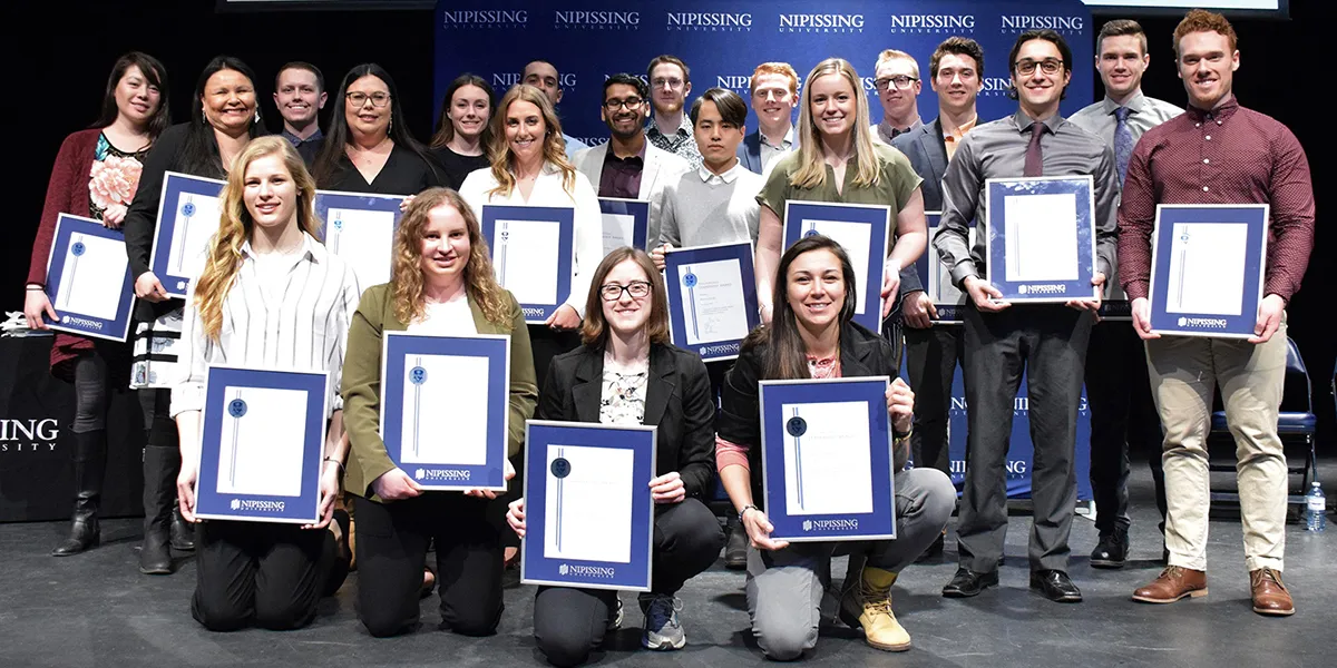 DMLA 2019 group with framed awards