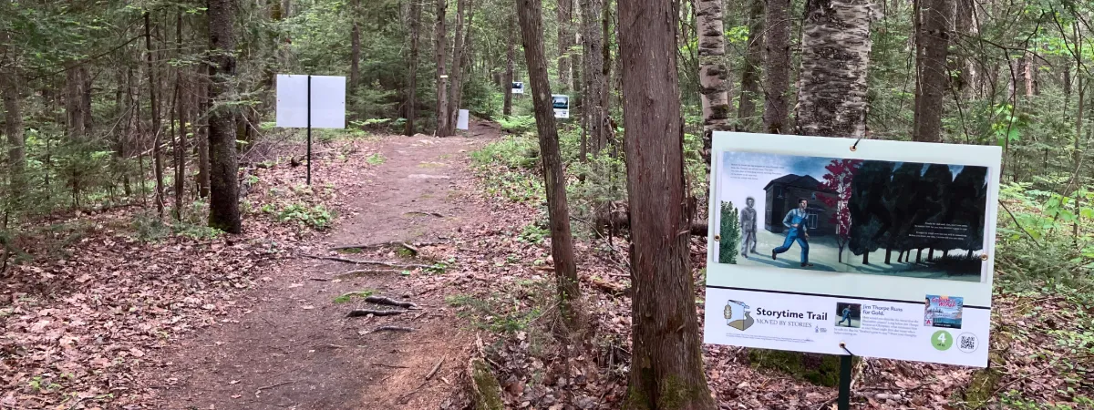 StoryWalk signs along the campus trails