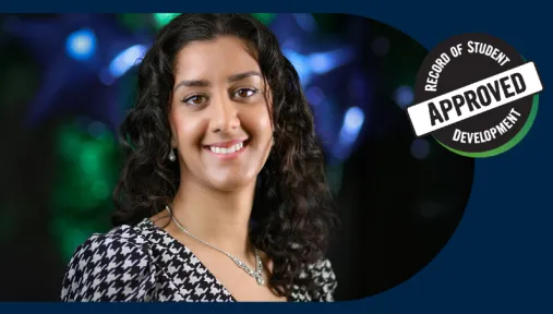 Headshot of Roshni smiling into the camera