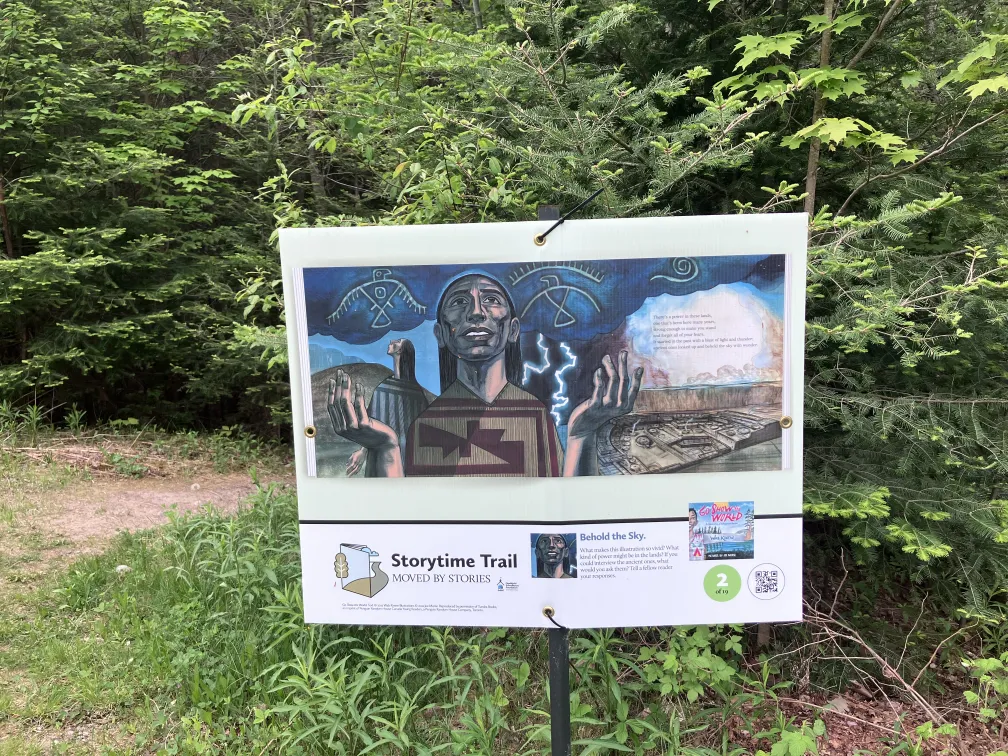 StoryWalk sign on the campus trail